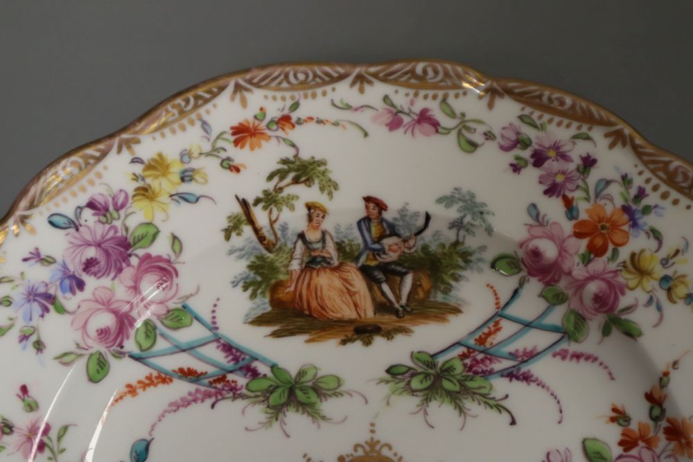 An 18th century Tournay or Arras moulded plate and a 19th century Meissen plate